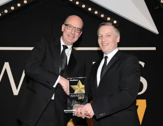 Martin Gurney, PSA Group director – fleet and used vehicles (left), is presented with the award by Elliot Scott, fleet director, Thrifty Car & Van Rental