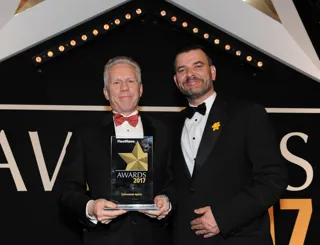 Dale Eynon, head of Defra group fleet services (left), collects the award from Neil Broad, general manager, Toyota & Lexus Fleet
