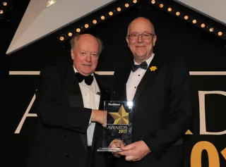 Chairman of the judging panel Christopher Macgowan OBE (left) presents the award to FleetCheck managing director Peter Golding