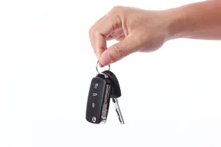 Person holding a set of car keys