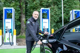 Man using new BP Pulse rapid charge point on the M8 Harthill services