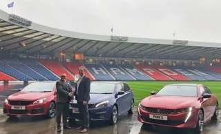 Scottish FA Chief Executive Ian Maxwell (right) takes delivery of the new Peugeot fleet, funded by Free2Move Lease