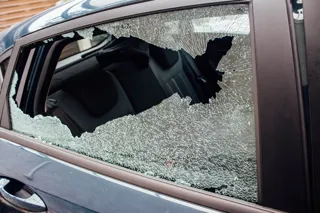Smashed rear door window on a car
