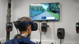 Man wearing virtual reality headset in e-scooter sound testing