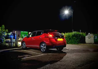 EV at charge point at night