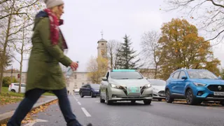 Pedestrian crossing the road in front of driverless car