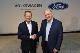 Ford President and CEO Jim Hackett and Volkswagen CEO Dr. Herbert Diess shake hands