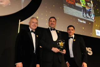 Pictured: (L) Awards host Huw Edwards presenting the award to AA's Stuart Thomas 