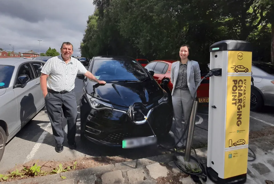 Councillor Alan Quinn and Candice Turner from Enterprise Car Club with the electric hire cars at Fairfax Road, Prestwich