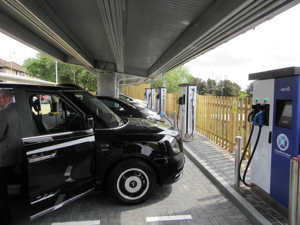 Electric taxi charging at Evolt rapid charge point