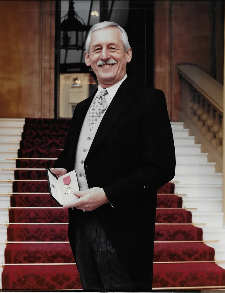 Geoffrey Atkinson picking up his OBE