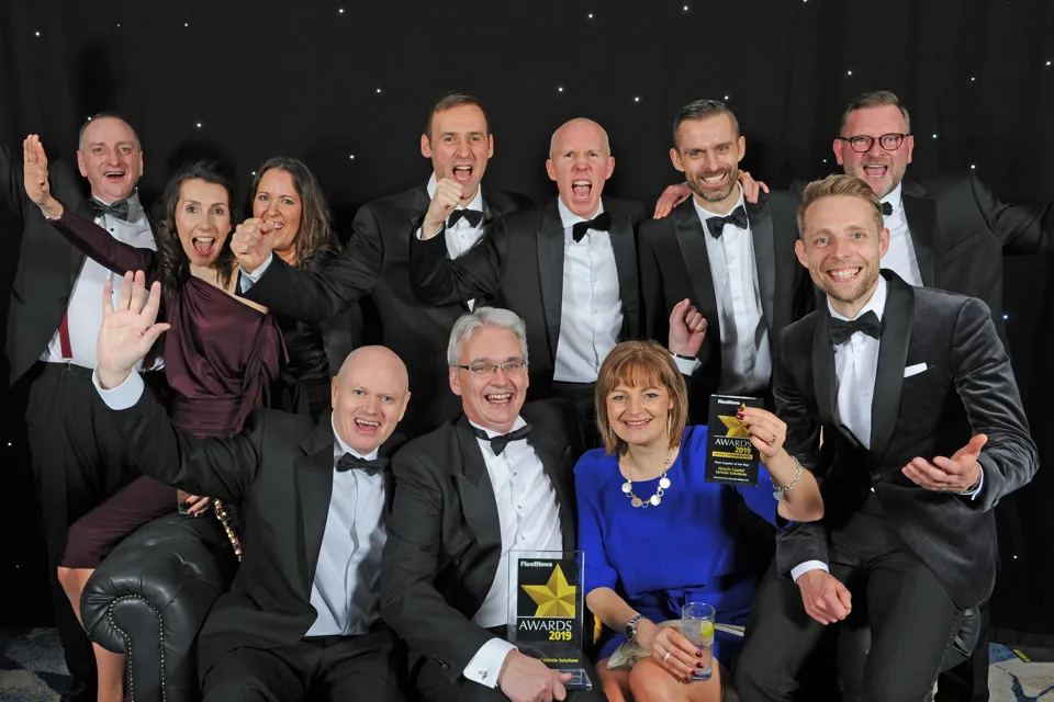 Jon Lawes (centre front) celebrates the Fleet News Award win with members of his team