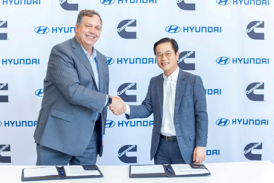 Representatives from Hyundai and Cummins shaking hands