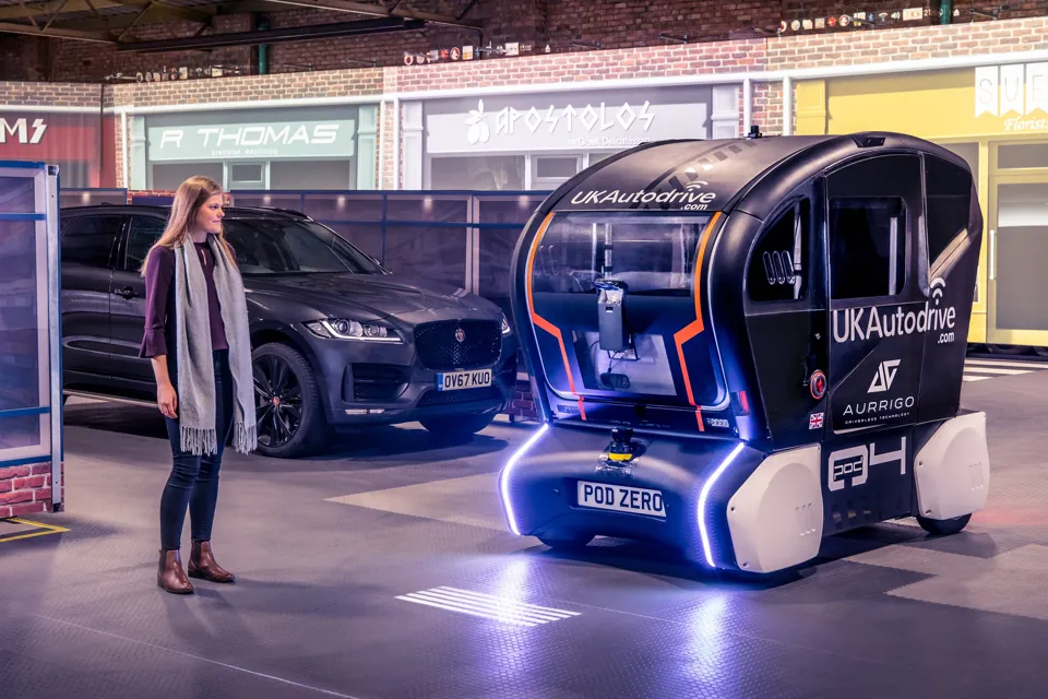 JLR self-driving pod and pedestrian