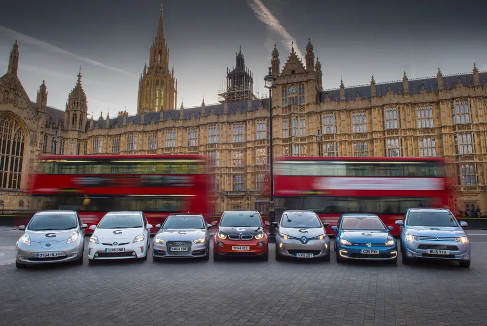 Line-up of electric vehicles outside the Houses of Parliament