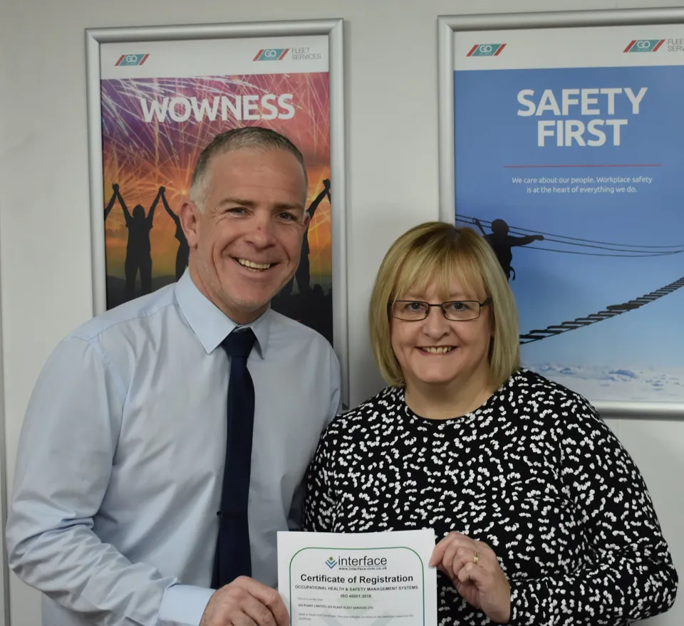 CAPTION: Antony Draper, Head of Health, Safety, Environment and Quality at Go Plant Fleet Services, and Juliet Howells, Senior Compliance Officer, are pictured with the ISO 45001 certificate.