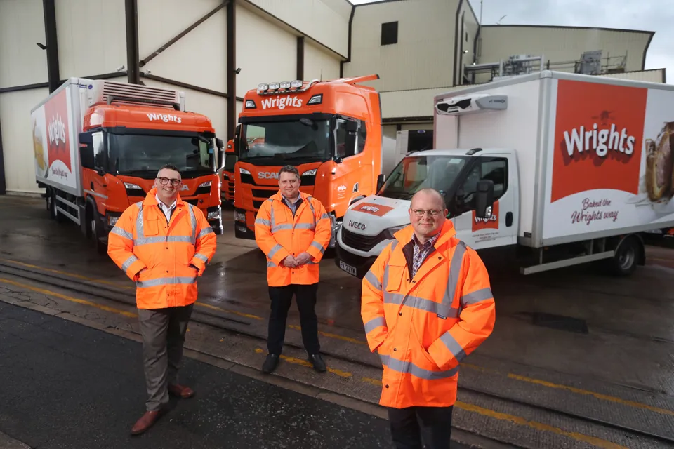 Wrights’ head of supply chain, Scott Wing, logistics and transport manager, Scott Tingle, and health, safety and environmental compliance manager Paul Strangwood with three of the new CNG fleet outside the Crewe headquarters.